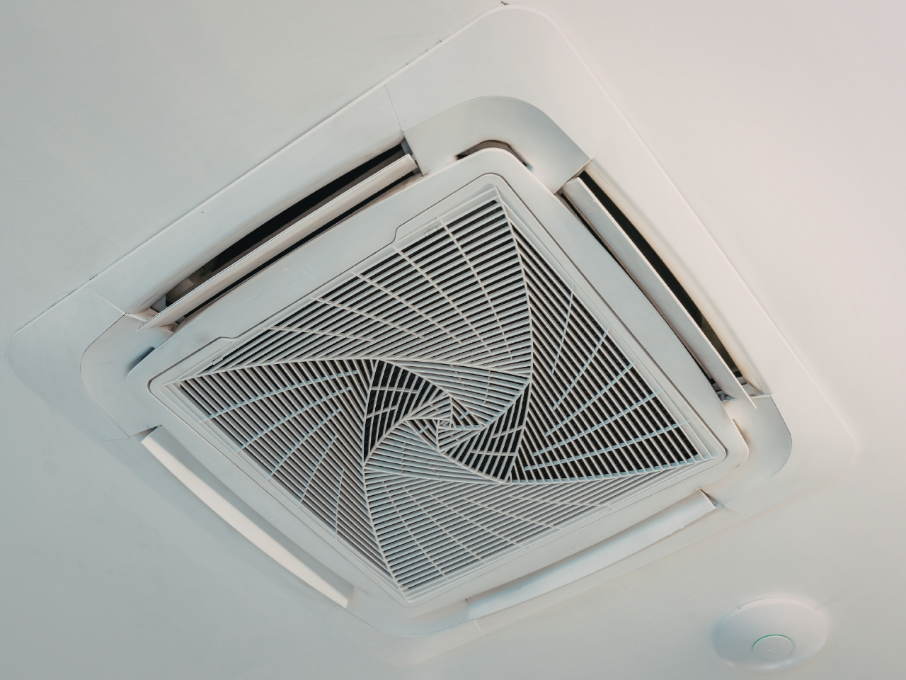 Ducted air conditioner vent checked as part of preventative maintenance