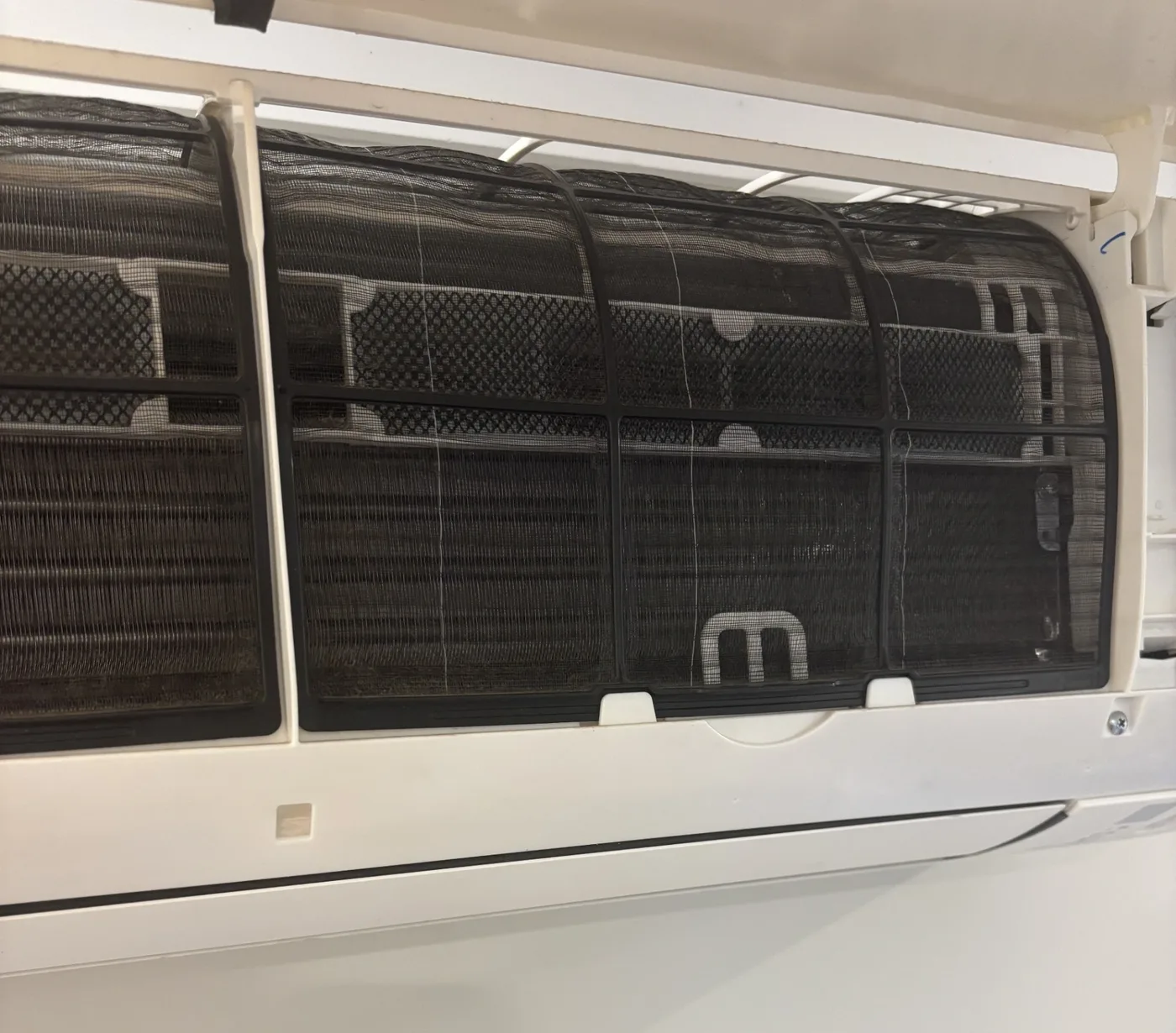 Clean split system air conditioner indoor unit — regular servicing extends air conditioner lifespan