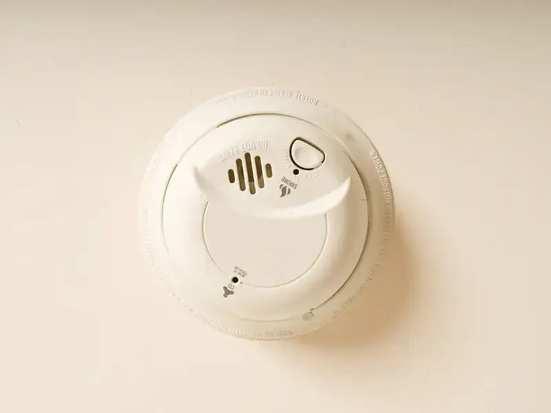 Interconnected photoelectric smoke alarm installed on a home ceiling